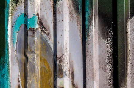 Old paint on a metal sheet as an abstract background.の写真素材