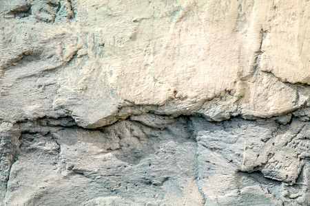 Destroyed concrete wall as backgroundの写真素材