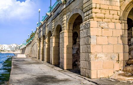 Sandstone brick embankment on a clear day in Maltaの写真素材