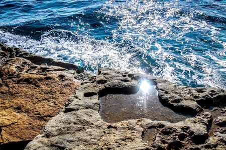Sea stones rocks washed by sea waves-seascapeの写真素材