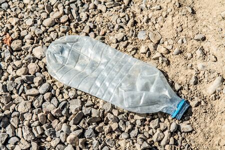 plastic bottle trash in nature ecology