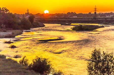 Sunset over mountain river landscapeの写真素材