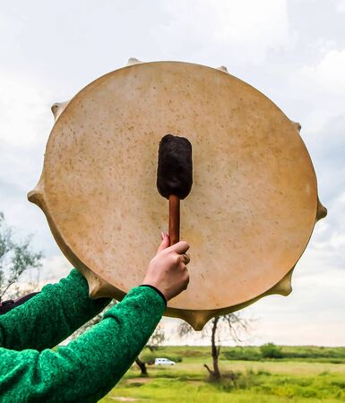 Shaman tambourine musical instrument against the skyの写真素材