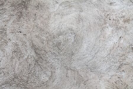 Gray plastered wall as an abstract backgroundの写真素材