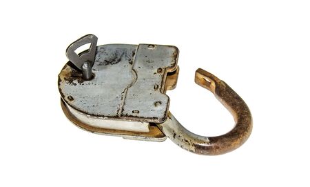 Old padlock with key on white background