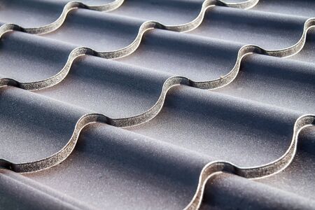 Metal profile to cover the roof of the house close-up as a backgroundの写真素材