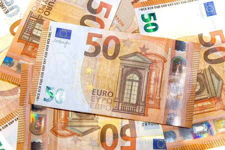 Euro notes are laid out creatively. Euro notes as a background on a long banner in high resolution. Beautiful original cash flow.の写真素材