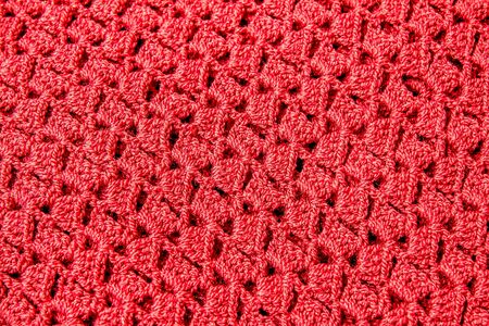 Pattern of woven threads handmade knitting as a backgroundの写真素材