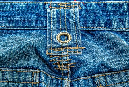 Jeans background. Denim fabric closeup. Textures of clothing fabric with fashion embroidery blue colors. Fashion & Style.の写真素材