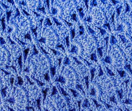 Pattern of woven threads handmade knitting as a backgroundの写真素材