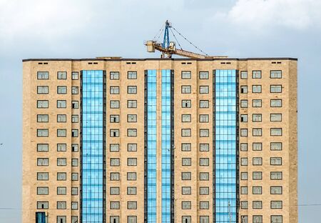 Tall building with large windows close-up as backgroundの写真素材