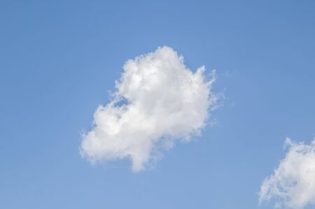 White cloud on a blue sky as a background, screensavers on a computer, creativity for design.の写真素材