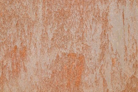 Old dirty rusty sheet of tin as a background. Close-up.