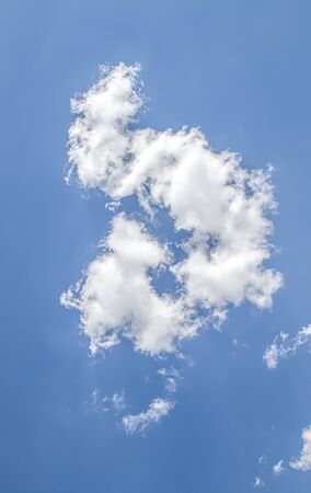 White cloud on a blue sky as a background, screensavers on a computer, creativity for design.の写真素材