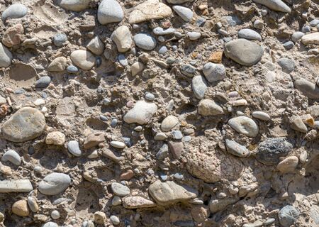 Wall of gravel and concrete as backgroundの写真素材
