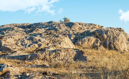 Stones rocks rocky ground against the skyの写真素材