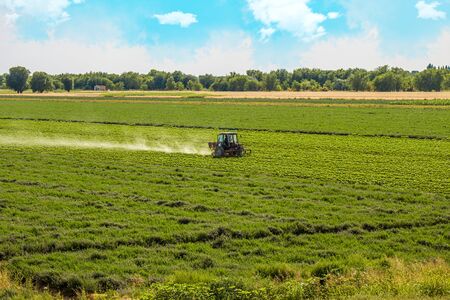 Cotton processing tractor spring landscapeの写真素材