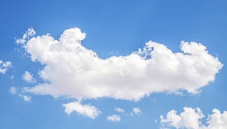 White cloud on a blue sky as a background, screensavers on a computer, creativity for design.の写真素材