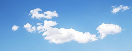 White cloud on a blue sky as a background, screensavers on a computer, creativity for design.の写真素材