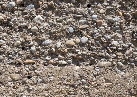 Wall of gravel and concrete as backgroundの写真素材