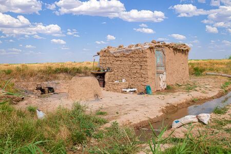 Temporary dwelling Cottage in a clay field in Kazakhstan. Rural landscapeの写真素材