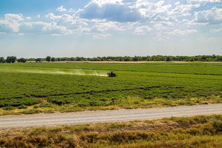 Cotton processing tractor spring landscapeの写真素材