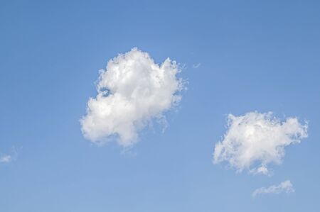White cloud on a blue sky as a background, screensavers on a computer, creativity for design.の写真素材