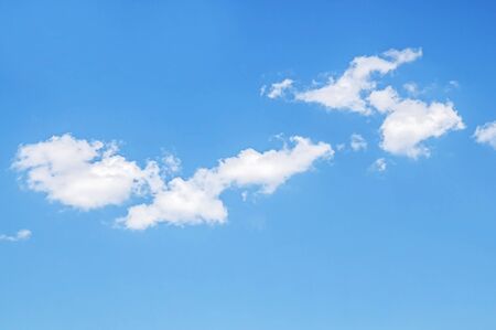 White cloud on a blue sky as a background, screensavers on a computer, creativity for design.の写真素材