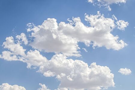 White cloud on a blue sky as a background, screensavers on a computer, creativity for design.の写真素材