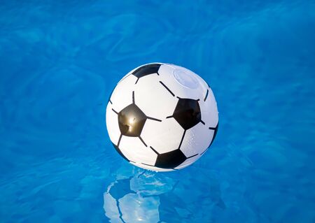 Beach Ball in the pool close-upの写真素材