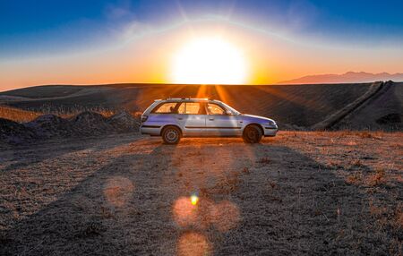 Auto on the background of the sunriseの写真素材