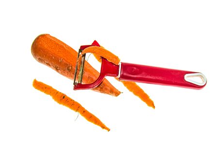 Peeling carrots close-up. The concept of a healthy diet. Vegetarianism.の写真素材