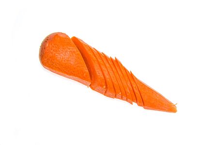 Peeled and chopped carrots on a white backgroundの写真素材