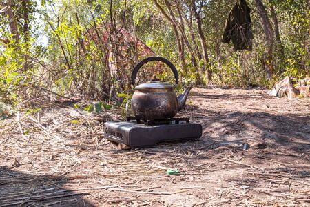 Kettle on the stove in natureの写真素材