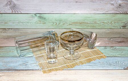Empty glassware lit by the sun.の写真素材