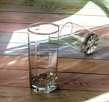 Empty glassware lit by the sun.の写真素材