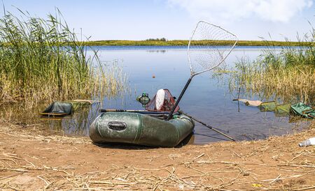 Inflatable fishing boat on the shoreの写真素材