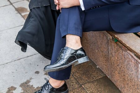 Legs of a man in black shoesの写真素材