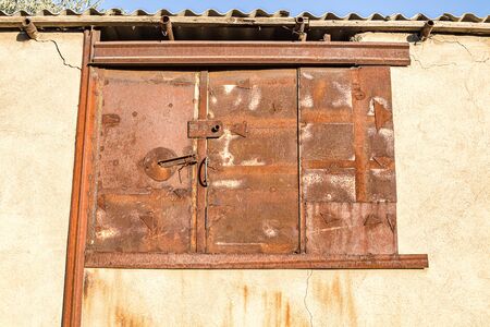 Rusty blank window in the wallの写真素材