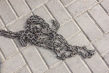 Iron chain on concrete floor