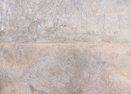 Old wall plastered with cement mortar as background for designの写真素材