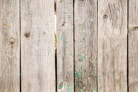 Old wooden fence from boards as a background for designの写真素材