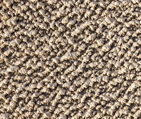 Wall plastered with cement mortar coat as a background for designの写真素材