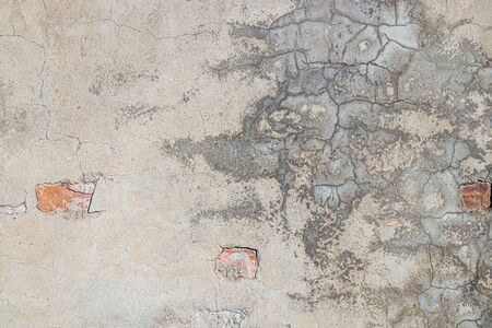 Old wall plastered with cement mortar as background for designの写真素材