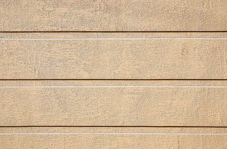 Wall plastered with putty bark beetle painted as background for designの写真素材