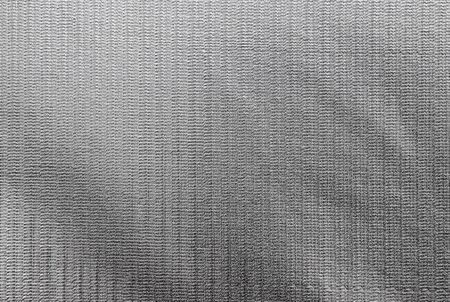Wall of gray granular material as a backgroundの写真素材
