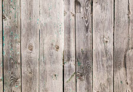 Old wooden fence from boards as a background for designの写真素材