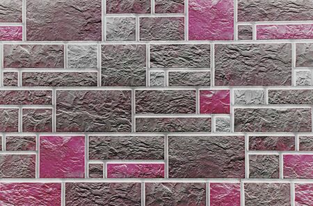 Wall of colored artificial stone as a background.の写真素材
