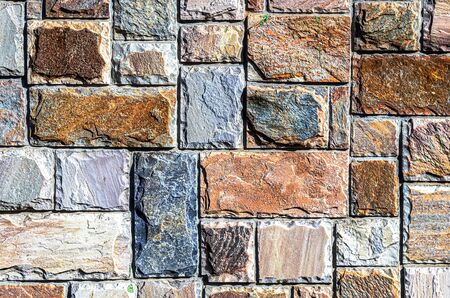 Wall of colored artificial stone as a background.の写真素材