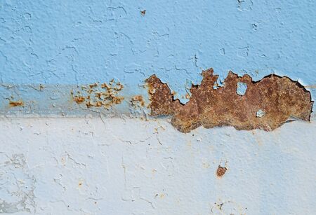 Old rusty painted metal surface as backgroundの写真素材